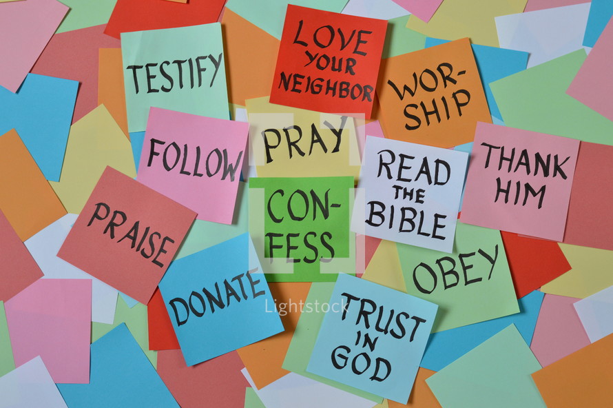 colorful pile of notepads with new year's resolutions for christian life