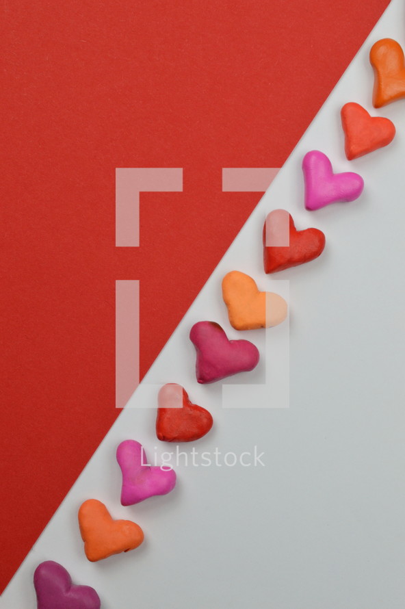 hearts, pink, orange, red on white and red background 