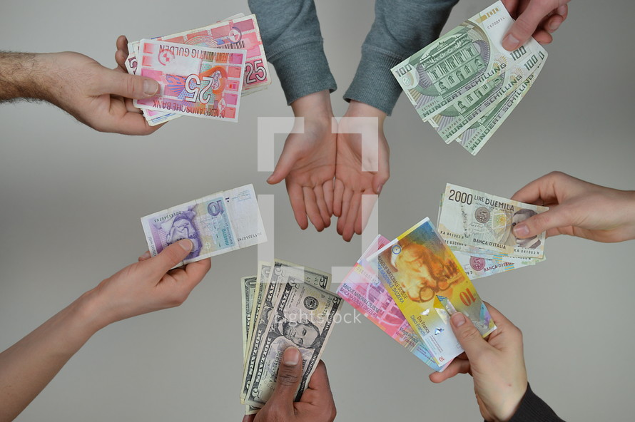 various currency and receiving hands 