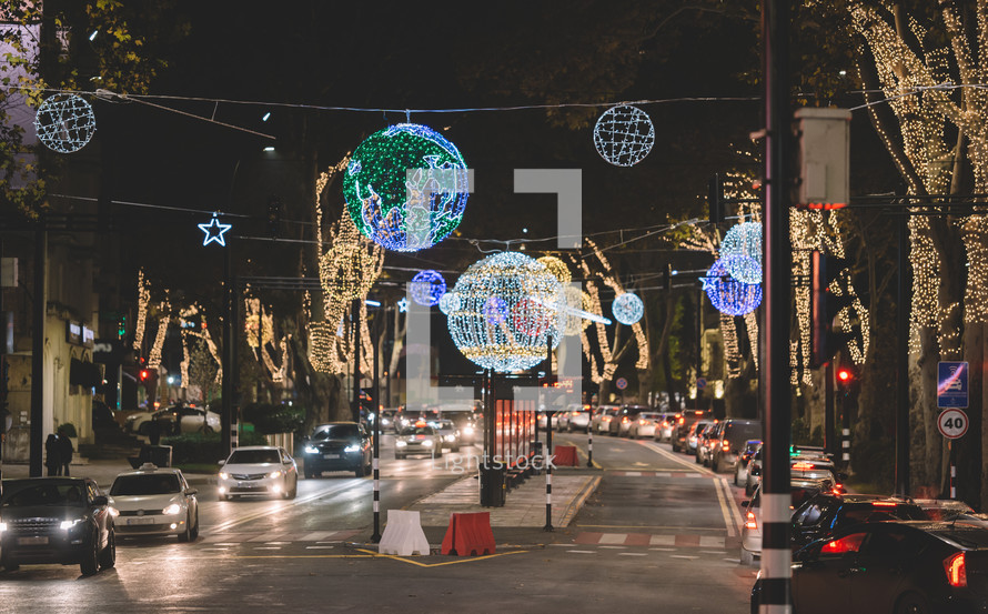 Traffic and Christmas decorations in the street at night