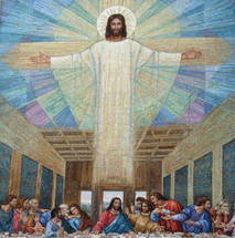 A large mural painting of Jesus over a painting depicting The last supper painting from early church art history.