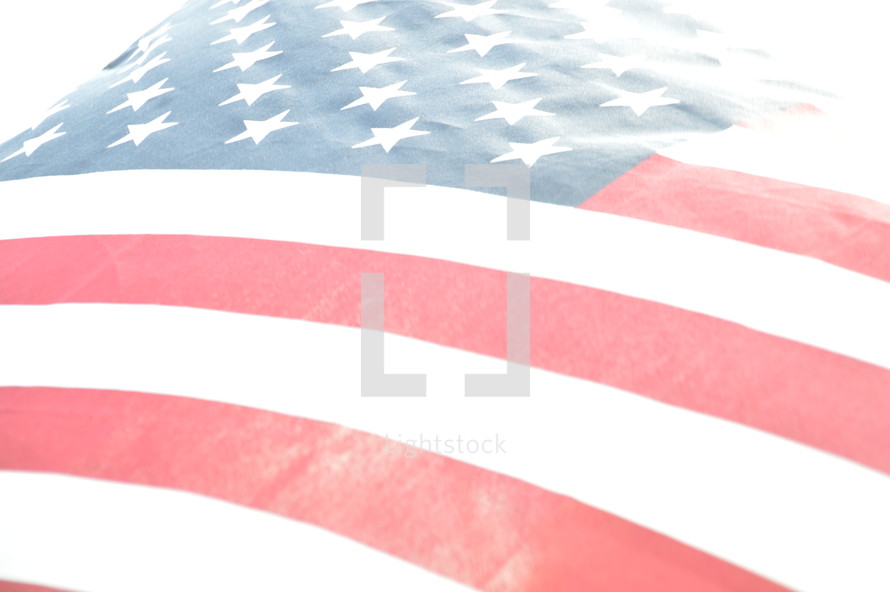close-up of bright american flag illuminated from behind