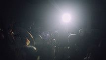 spotlight shining on an audience 