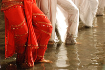 feet of belly dancers in water