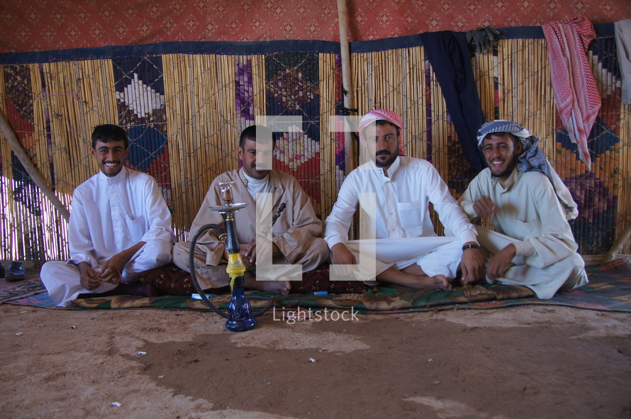 Nomadic tribesmen in desert tent