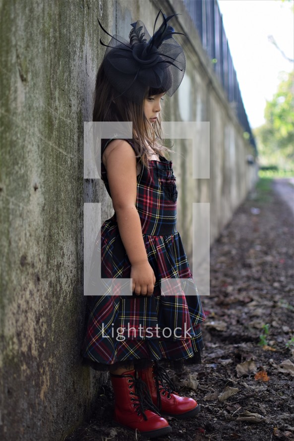 a little girl outdoors dressed up 
