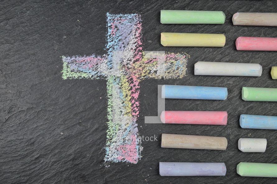 cross in sidewalk chalk on slate