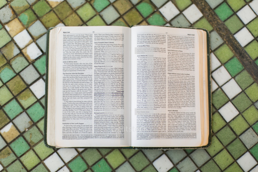 open Bible on a tile top table 