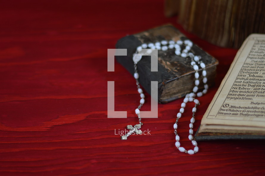 rosary and open Bible 