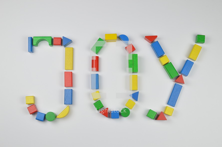word joy of colorful toy wooden blocks