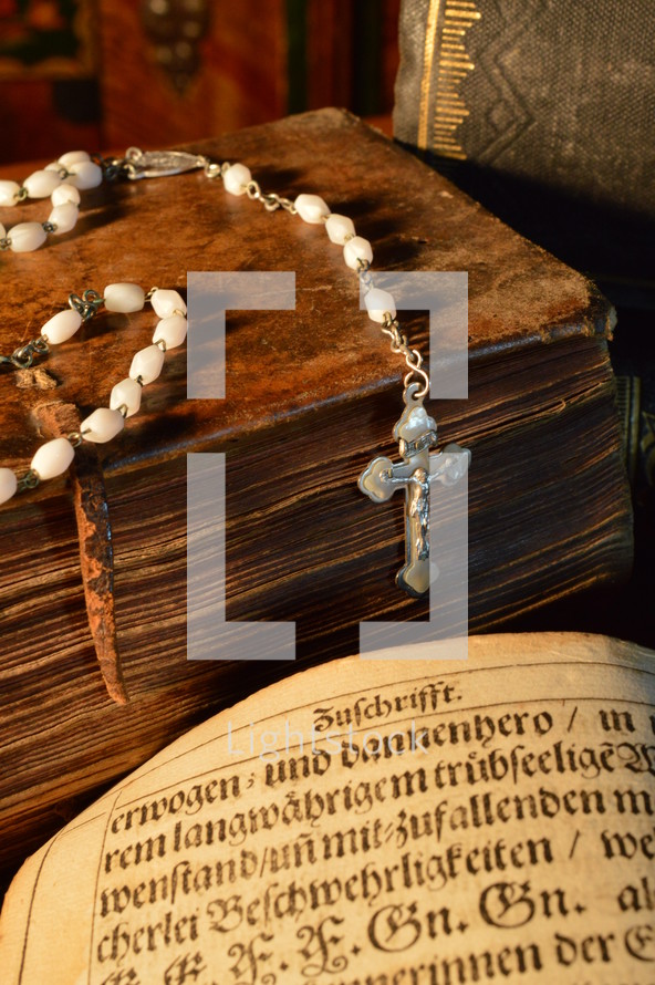 rosary on an old Bible 