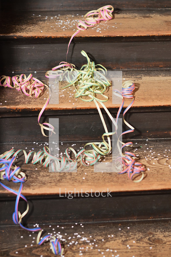 confetti and ribbons on wood steps 