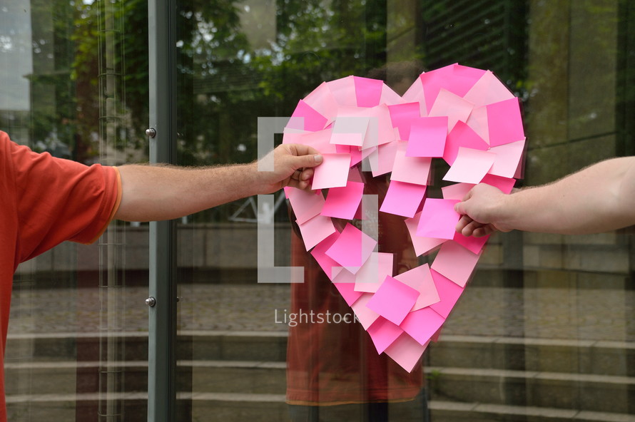 sticky notes in the shape of a heart 