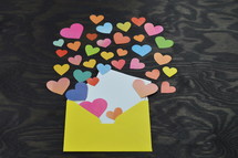 hearts pouring out of an envelope 