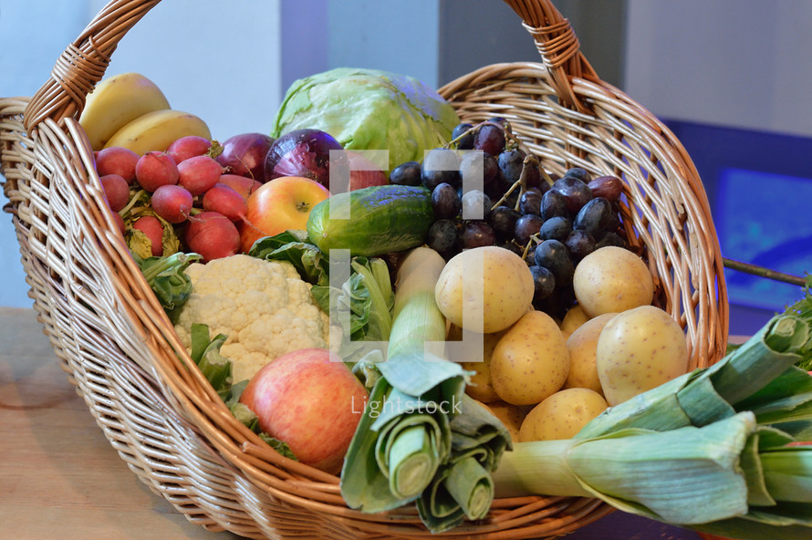 basket filled with selection of different fruits and vegetables