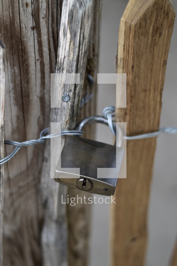 Padlock on a wooden fence. 