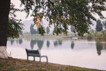 Bench by the lake in autumn