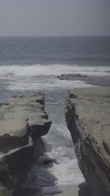 Ocean waves on a rocky shore.