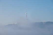 Foggy mast on a hill