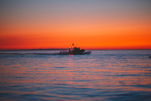 Patrol boat at sunset