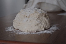 Making bread - dough and flour on counter