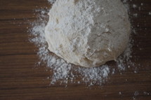 Making bread - dough and flour on counter