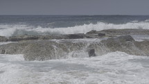 Crashing ocean waves on a rocky shore.