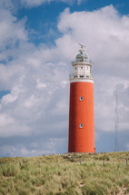 Red lighthouse in the coastline