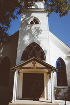 exterior of a rural white church 