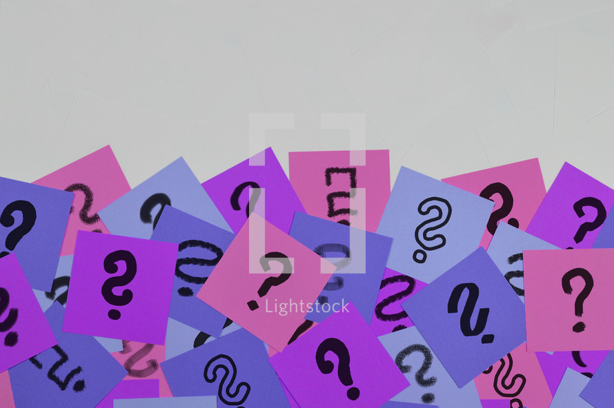 question marks on paper 