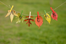 string with leaves and letters spelling: AUTUMN