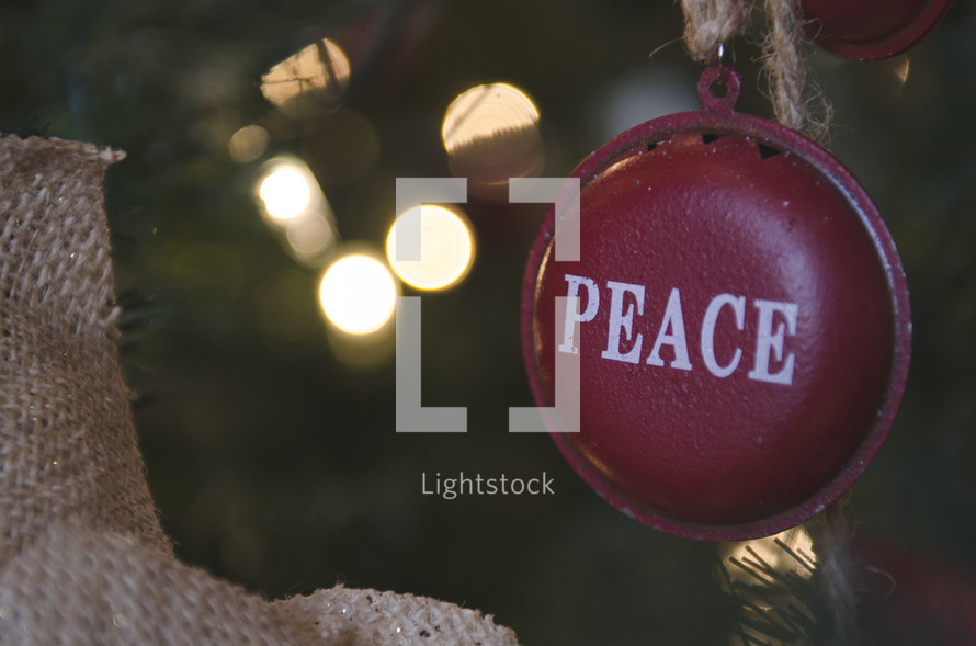 peace Christmas ornament on a Christmas tree