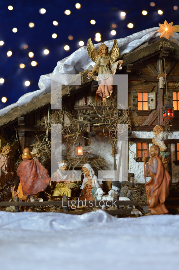 Nativity scene and blue bokeh light background 