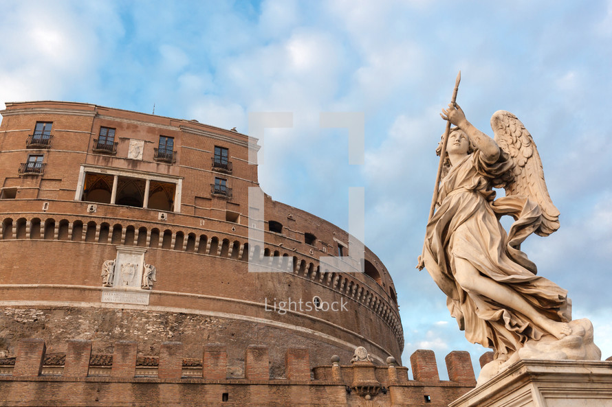 Statue of an angel standing on the bridge leading to the Castle Sant'Angelo, Rome