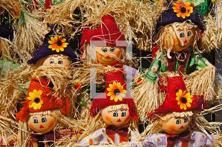 Scarecrow dolls. Straw, autumn, red, child, toy, hat, flower, fall