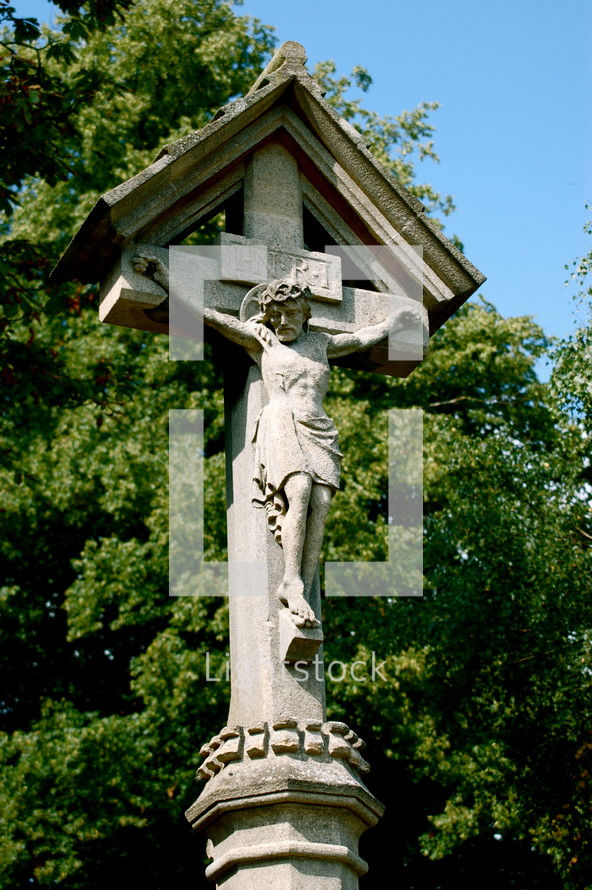 Stone crucifix statue