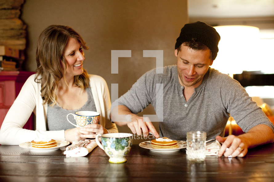 couple eating breakfast together 