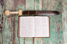 opened Bible and sword 