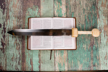 sword on the pages of a Bible 
