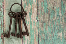 skeleton keys on a wood background 