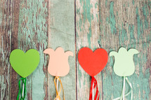 wooden hearts and flowers with strings 