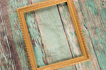 frame on a green wood background 