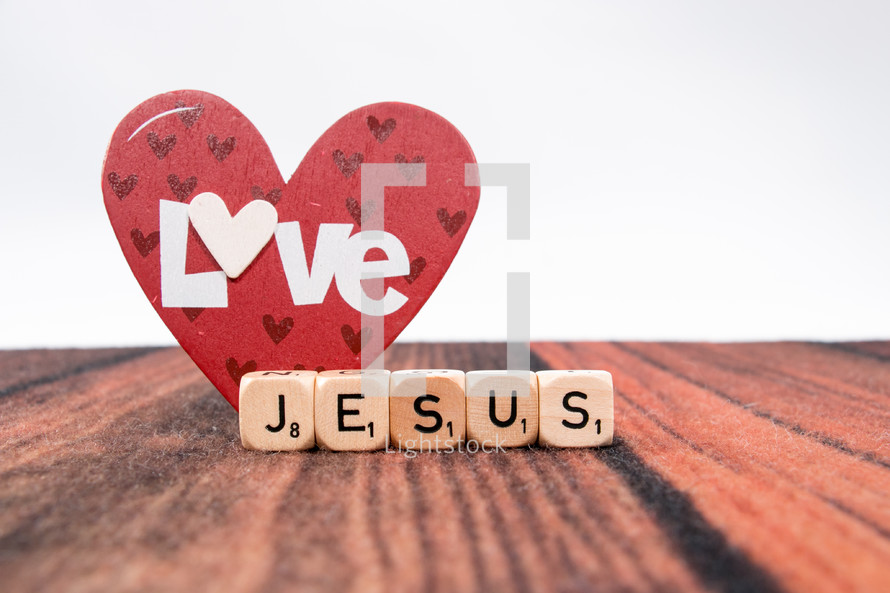 heart shape and word Jesus in scrabble pieces 