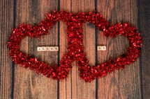 heart shaped wreaths and words Jesus and Us
