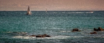 view of a sailboat from a shore 