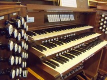 keys on an old church organ for a traditional praise and worship service.