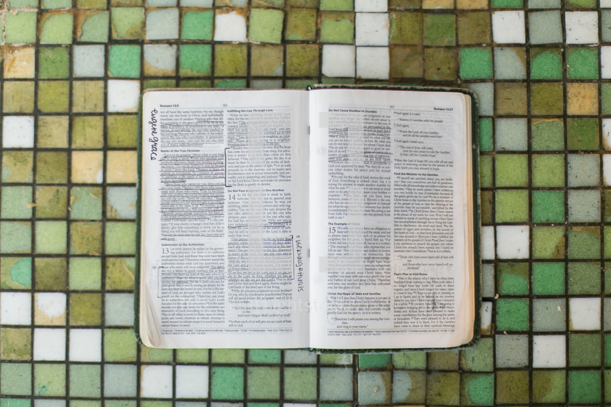 open Bible on tile 