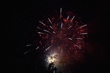 fireworks bursting in the night sky 