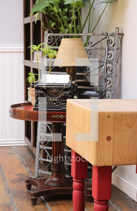 antique typewriter on a table 