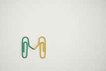 Concept Paperclips sign together on white background